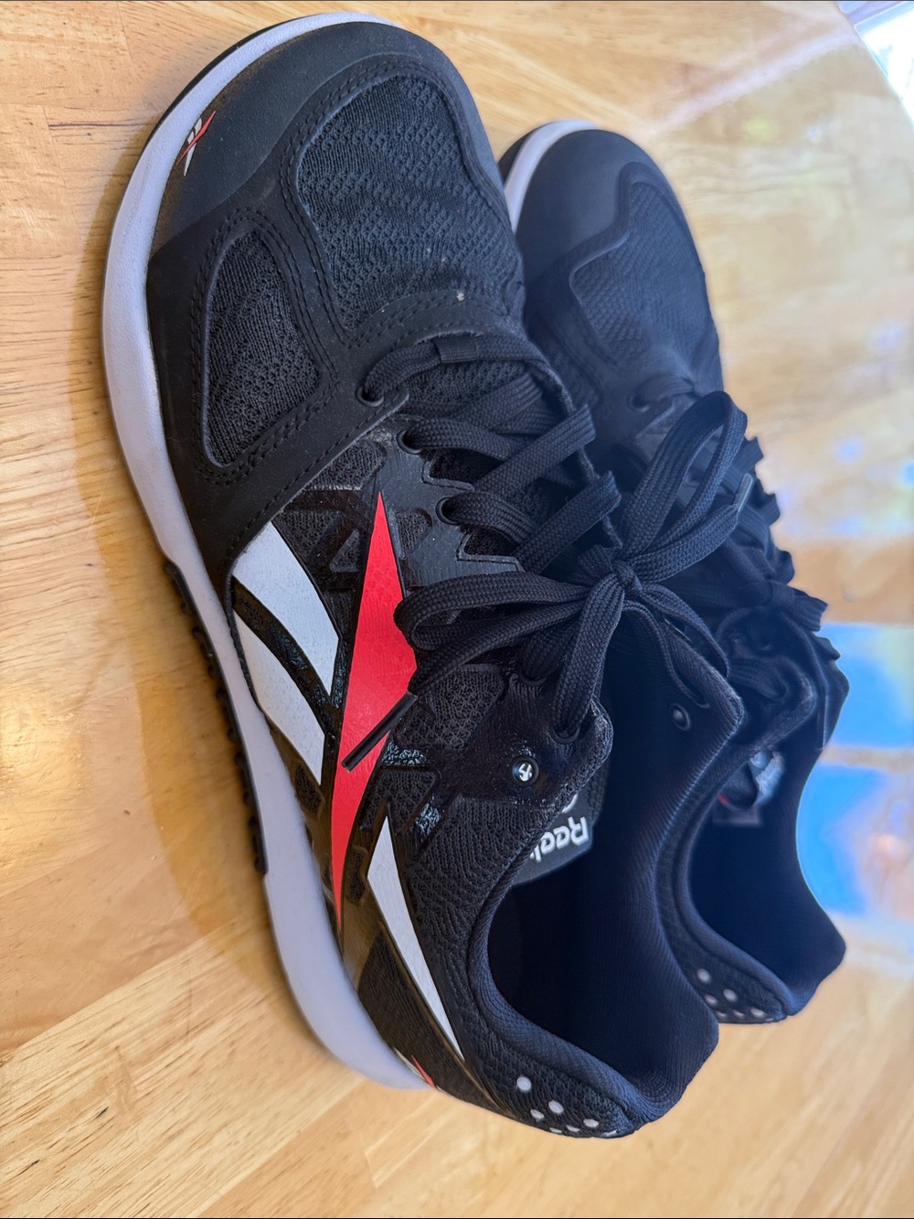 Reebok Black Sneakers with Red & White Logo Accents